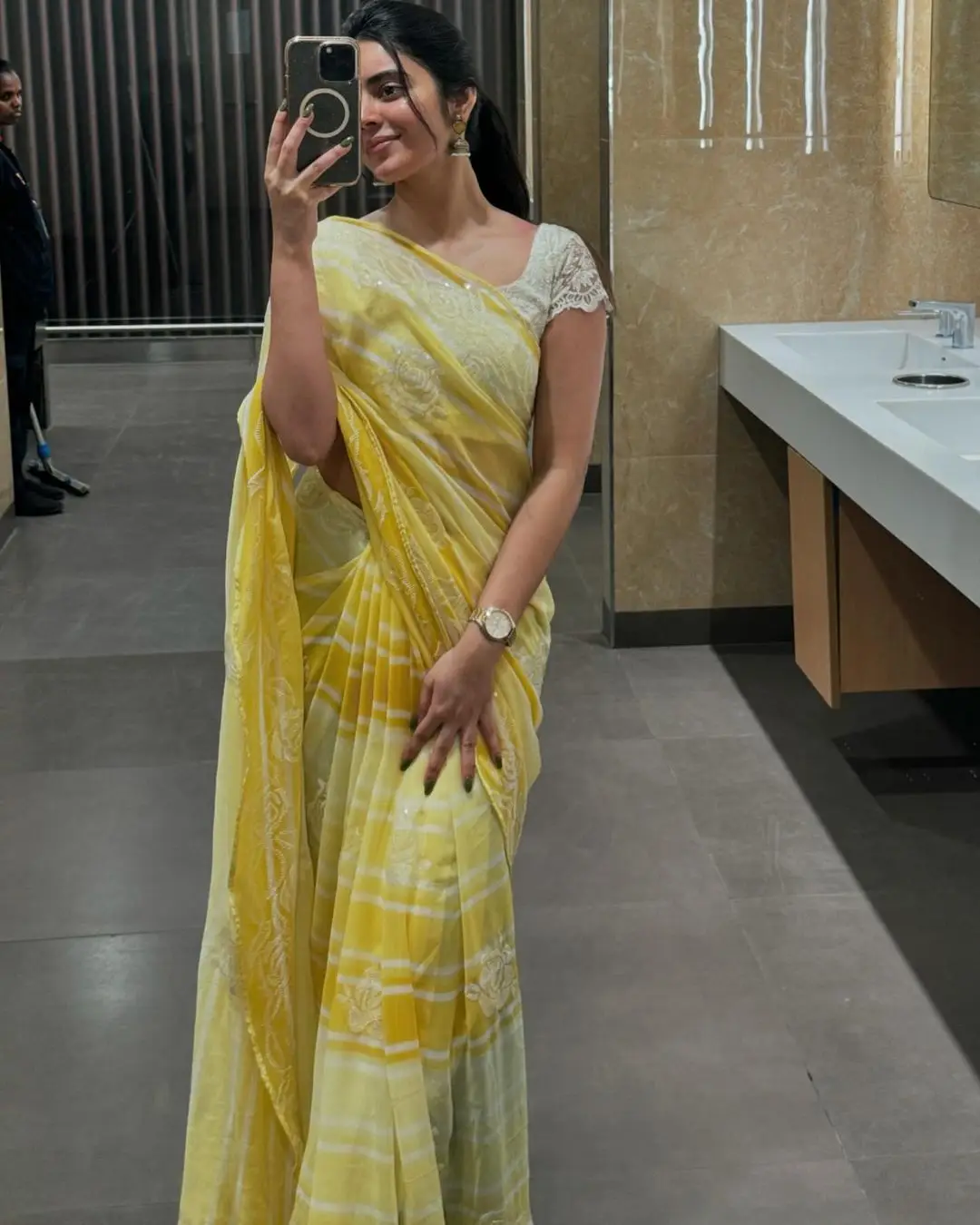 Kushita Kallapu In Traditional Yellow Saree White Blouse